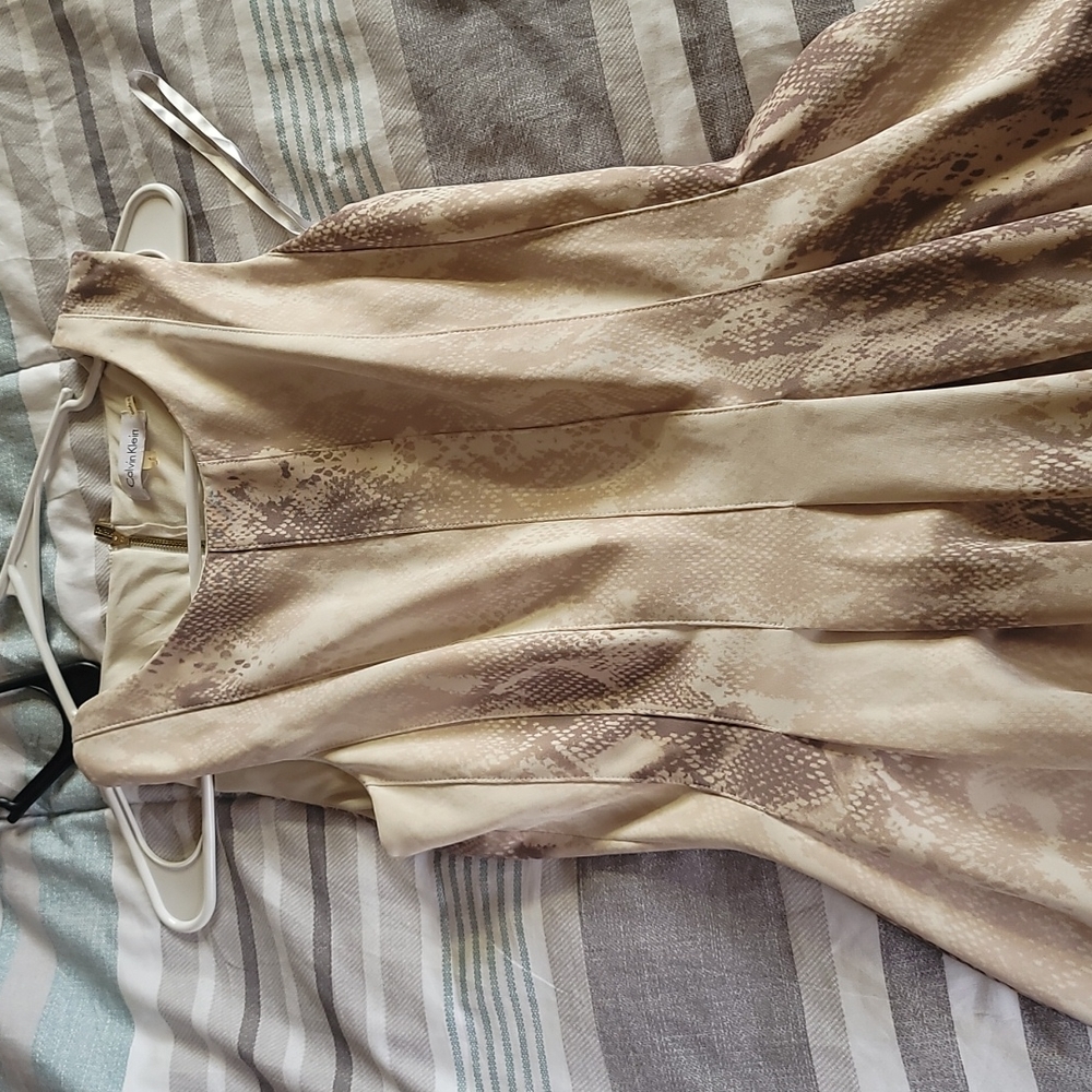 Calvin Klein snake skin look to it cream color
